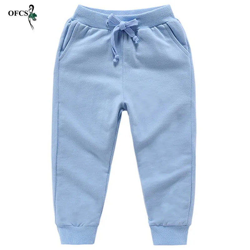 Nouvelle vente au détail pantalons en coton pour 2-10 ans solide garçons filles pantalons de Sport décontractés Jogging Enfant Garcon enfants pantalons pour enfants