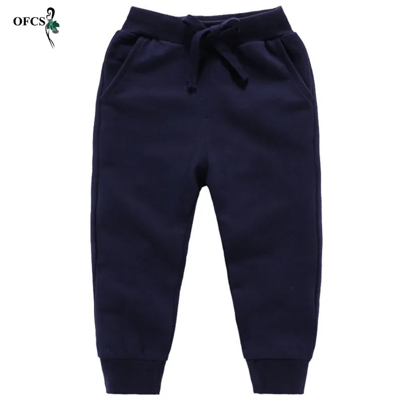 Nouvelle vente au détail pantalons en coton pour 2-10 ans solide garçons filles pantalons de Sport décontractés Jogging Enfant Garcon enfants pantalons pour enfants