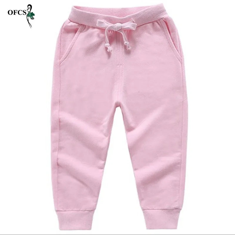 Nouvelle vente au détail pantalons en coton pour 2-10 ans solide garçons filles pantalons de Sport décontractés Jogging Enfant Garcon enfants pantalons pour enfants