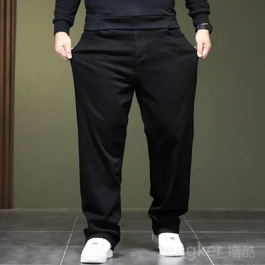 Haute élasticité printemps automne grande taille jeans noirs jeans droits hommes plus grande taille jeunesse élastique pantalons longs 44 46 48
