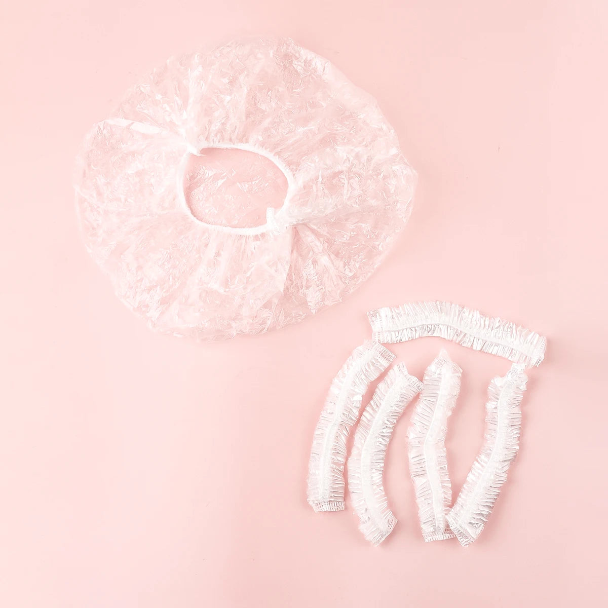 Bonnet de douche jetable 100 pièces, bande en plastique transparente, bonnet de beauté et de cheveux imperméable, agrandi et épaissi pour hôtels