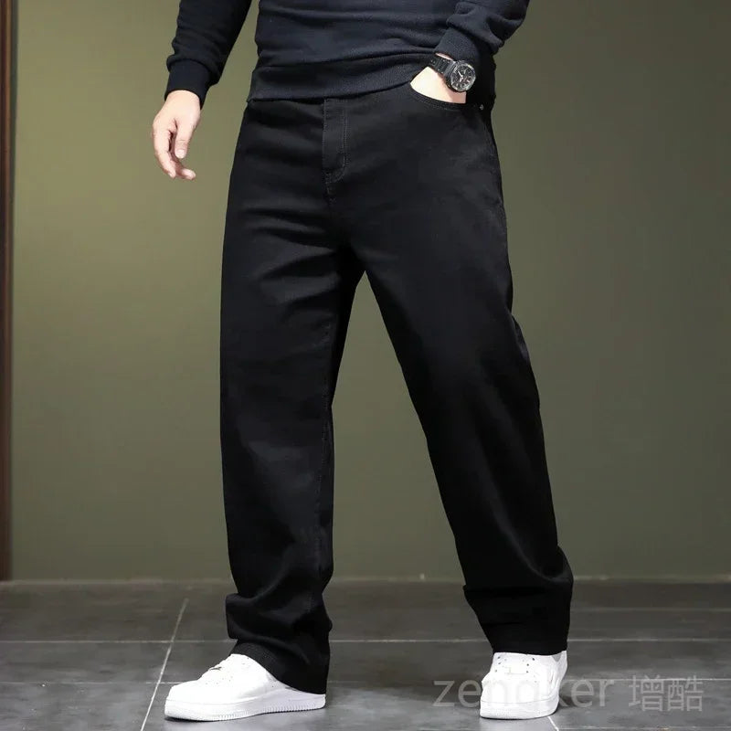 Haute élasticité printemps automne grande taille jeans noirs jeans droits hommes plus grande taille jeunesse élastique pantalons longs 44 46 48