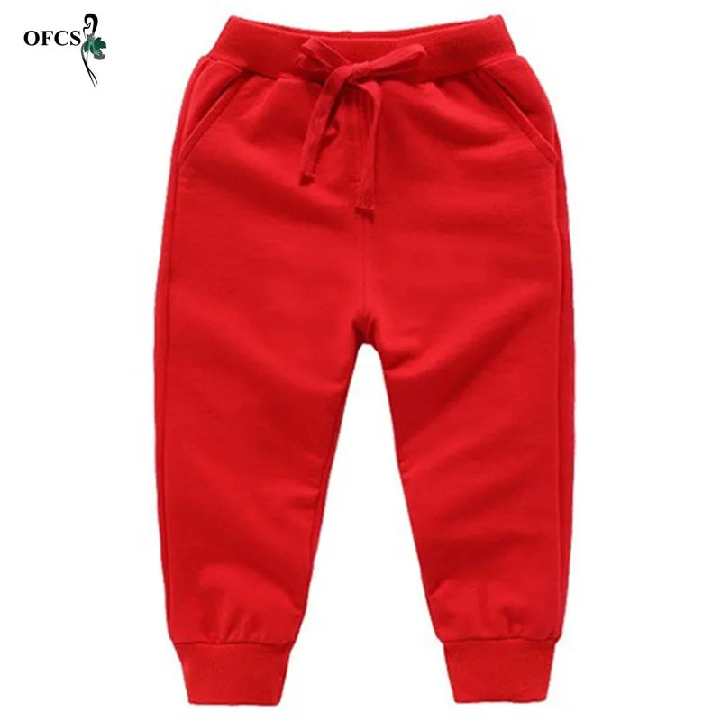 Nouvelle vente au détail pantalons en coton pour 2-10 ans solide garçons filles pantalons de Sport décontractés Jogging Enfant Garcon enfants pantalons pour enfants
