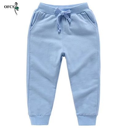 Nouvelle vente au détail pantalons en coton pour 2-10 ans solide garçons filles pantalons de Sport décontractés Jogging Enfant Garcon enfants pantalons pour enfants