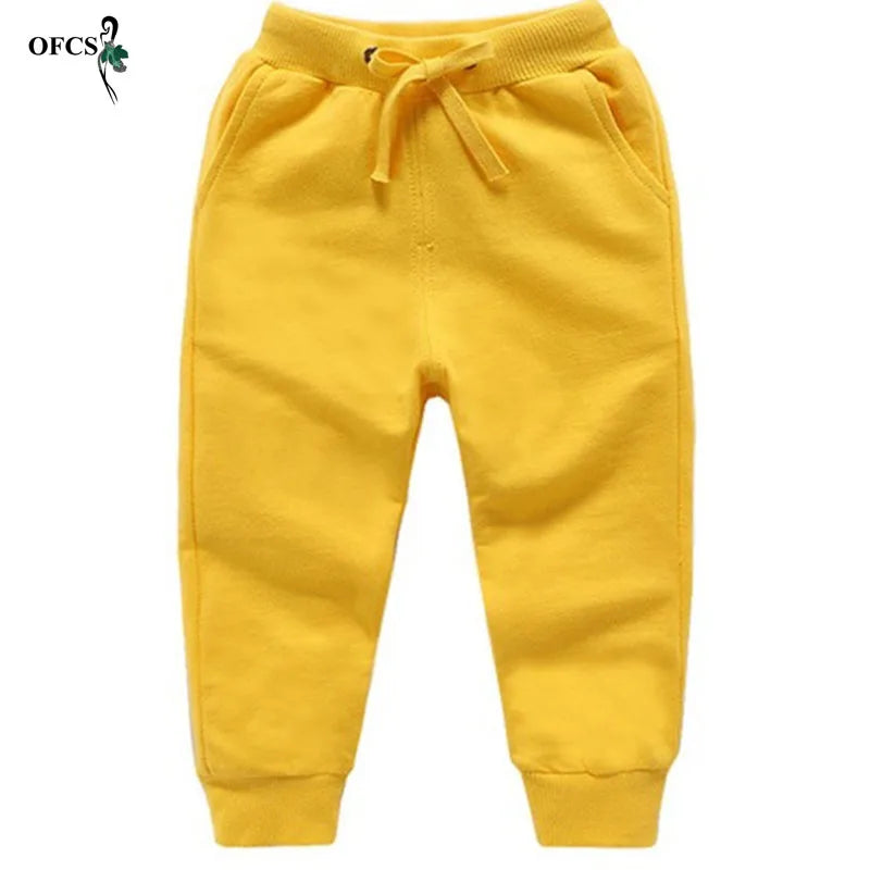 Nouvelle vente au détail pantalons en coton pour 2-10 ans solide garçons filles pantalons de Sport décontractés Jogging Enfant Garcon enfants pantalons pour enfants