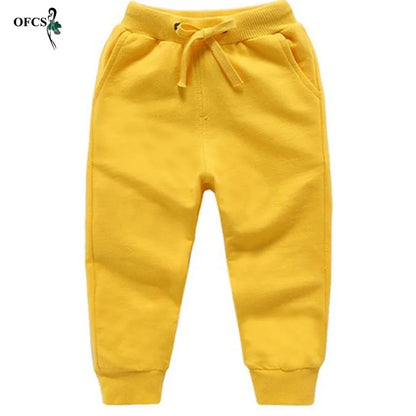 Nouvelle vente au détail pantalons en coton pour 2-10 ans solide garçons filles pantalons de Sport décontractés Jogging Enfant Garcon enfants pantalons pour enfants