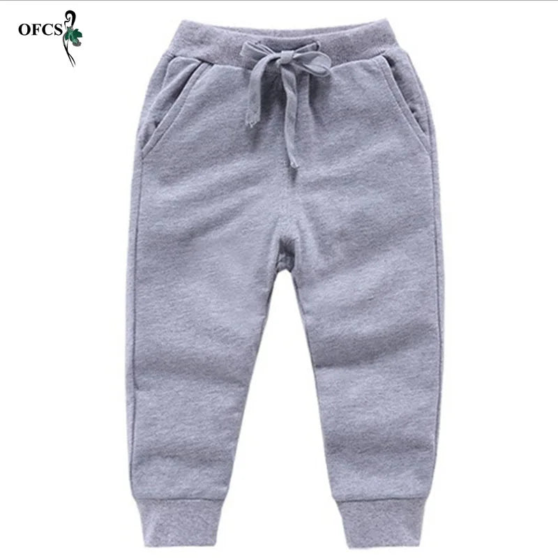 Nouvelle vente au détail pantalons en coton pour 2-10 ans solide garçons filles pantalons de Sport décontractés Jogging Enfant Garcon enfants pantalons pour enfants