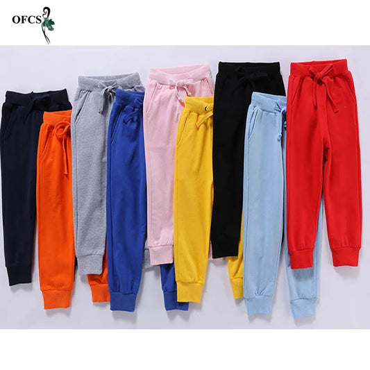 Nouvelle vente au détail pantalons en coton pour 2-10 ans solide garçons filles pantalons de Sport décontractés Jogging Enfant Garcon enfants pantalons pour enfants