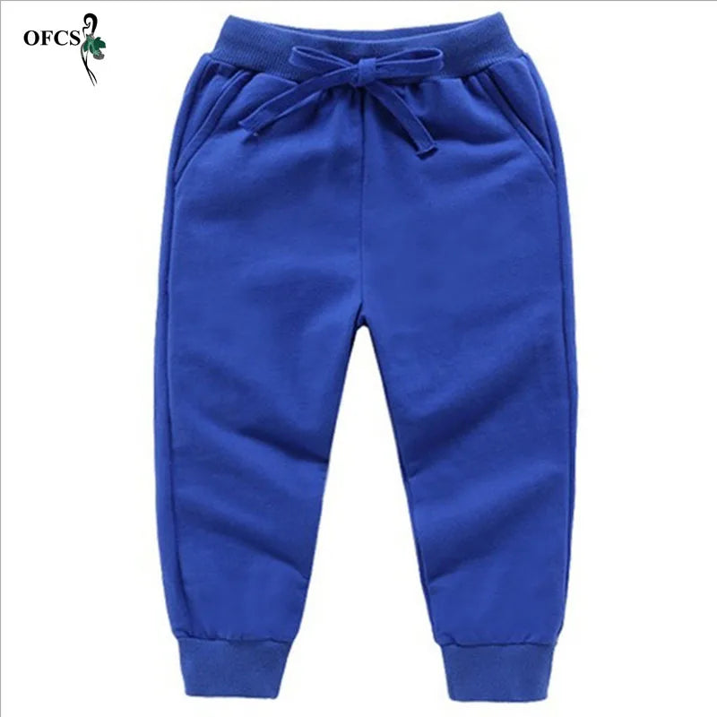 Nouvelle vente au détail pantalons en coton pour 2-10 ans solide garçons filles pantalons de Sport décontractés Jogging Enfant Garcon enfants pantalons pour enfants