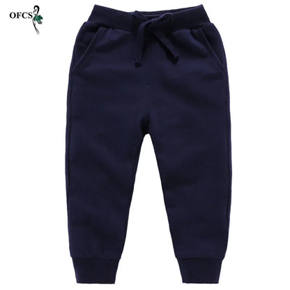 Nouvelle vente au détail pantalons en coton pour 2-10 ans solide garçons filles pantalons de Sport décontractés Jogging Enfant Garcon enfants pantalons pour enfants