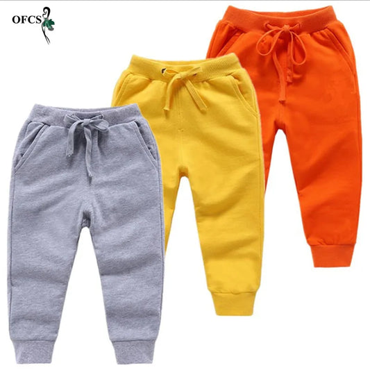 Nouvelle vente au détail pantalons en coton pour 2-10 ans solide garçons filles pantalons de Sport décontractés Jogging Enfant Garcon enfants pantalons pour enfants