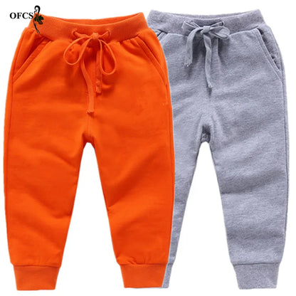 Nouvelle vente au détail pantalons en coton pour 2-10 ans solide garçons filles pantalons de Sport décontractés Jogging Enfant Garcon enfants pantalons pour enfants