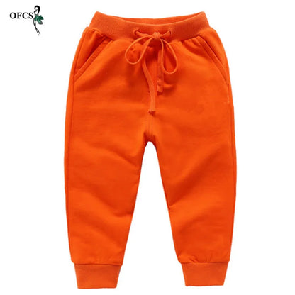 Nouvelle vente au détail pantalons en coton pour 2-10 ans solide garçons filles pantalons de Sport décontractés Jogging Enfant Garcon enfants pantalons pour enfants