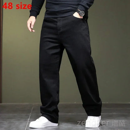 Haute élasticité printemps automne grande taille jeans noirs jeans droits hommes plus grande taille jeunesse élastique pantalons longs 44 46 48