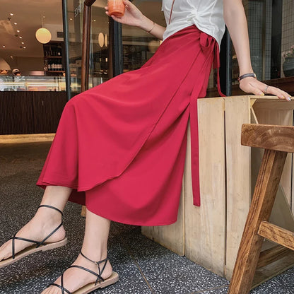 Printemps été automne plage jupe femmes 9 couleurs taille haute côté cravate décontracté jupe portefeuille femme solide élégant Midi jupe vêtements
