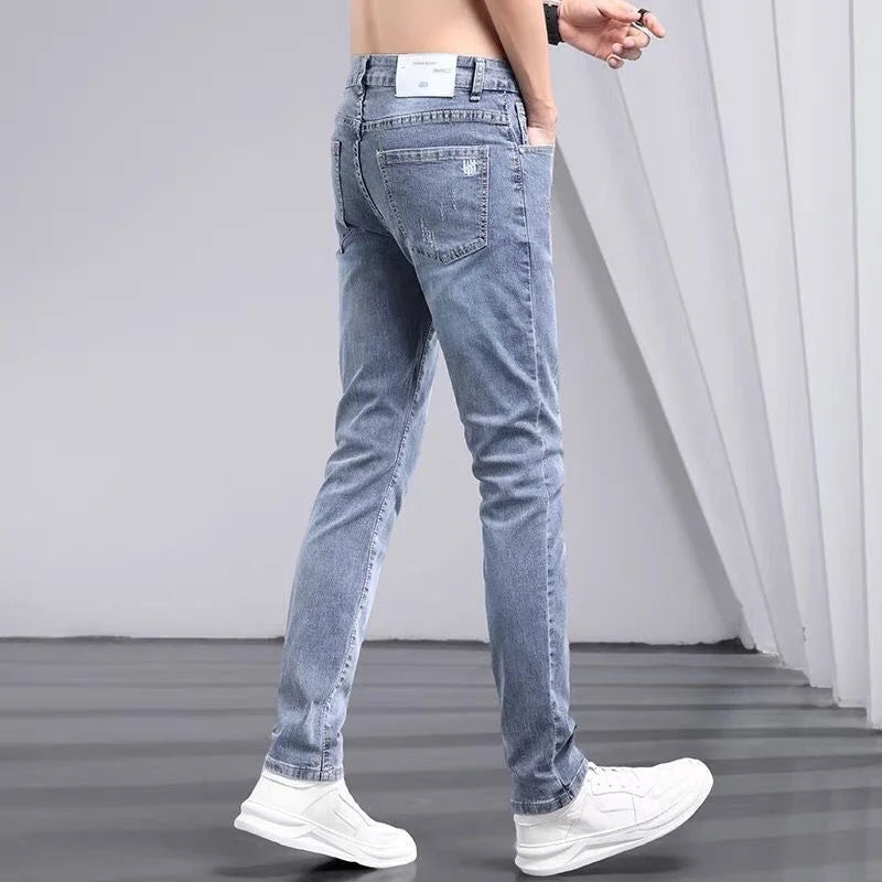 2025 été jean de couleur claire hommes à la mode marque jeunesse Slim-fit élastique Pantalon coréen pantalons longs Streetwear hommes Pantalon Homme