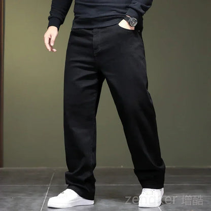 Haute élasticité printemps automne grande taille jeans noirs jeans droits hommes plus grande taille jeunesse élastique pantalons longs 44 46 48